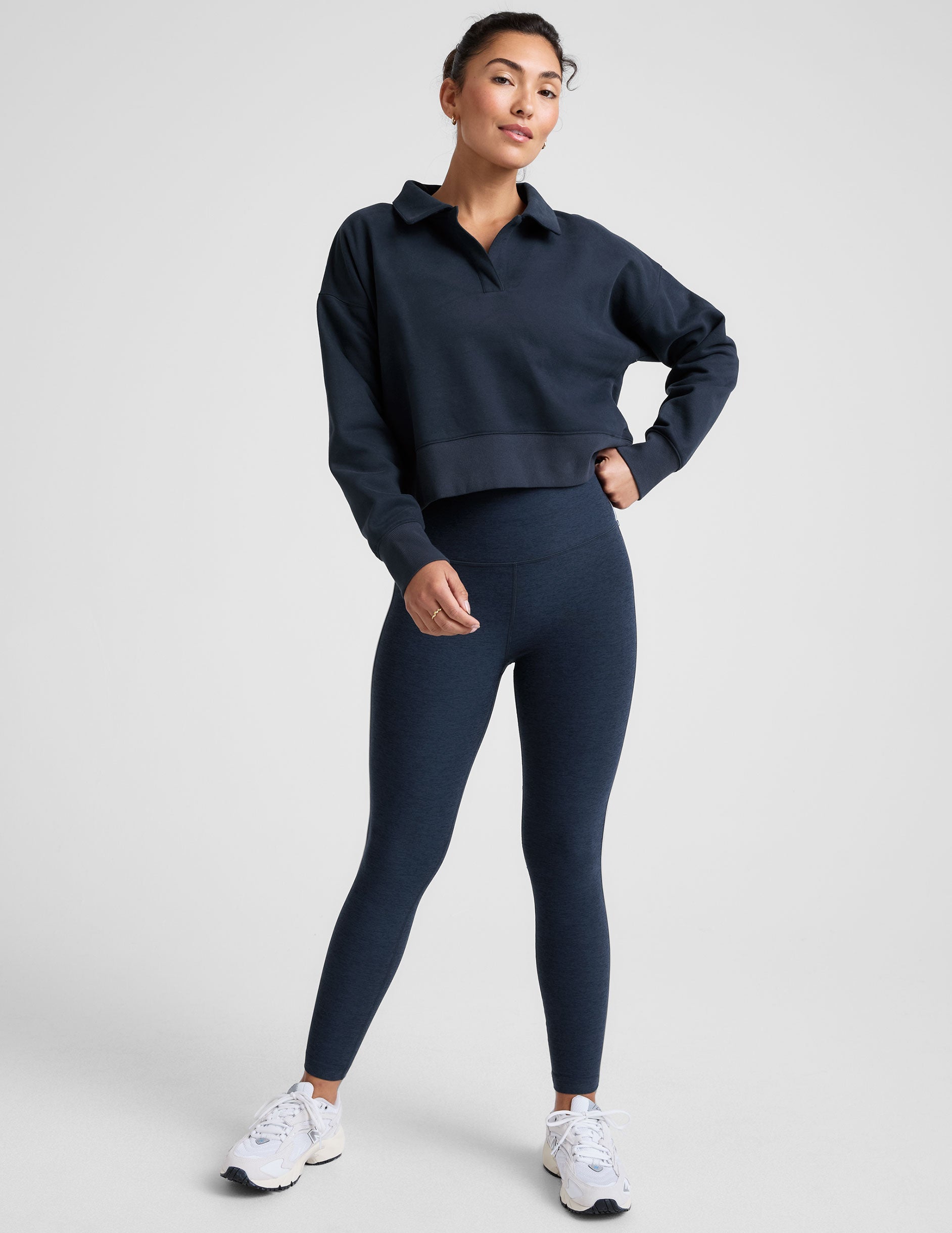 blue cropped long sleeve pullover with a v-neck collared neckline.