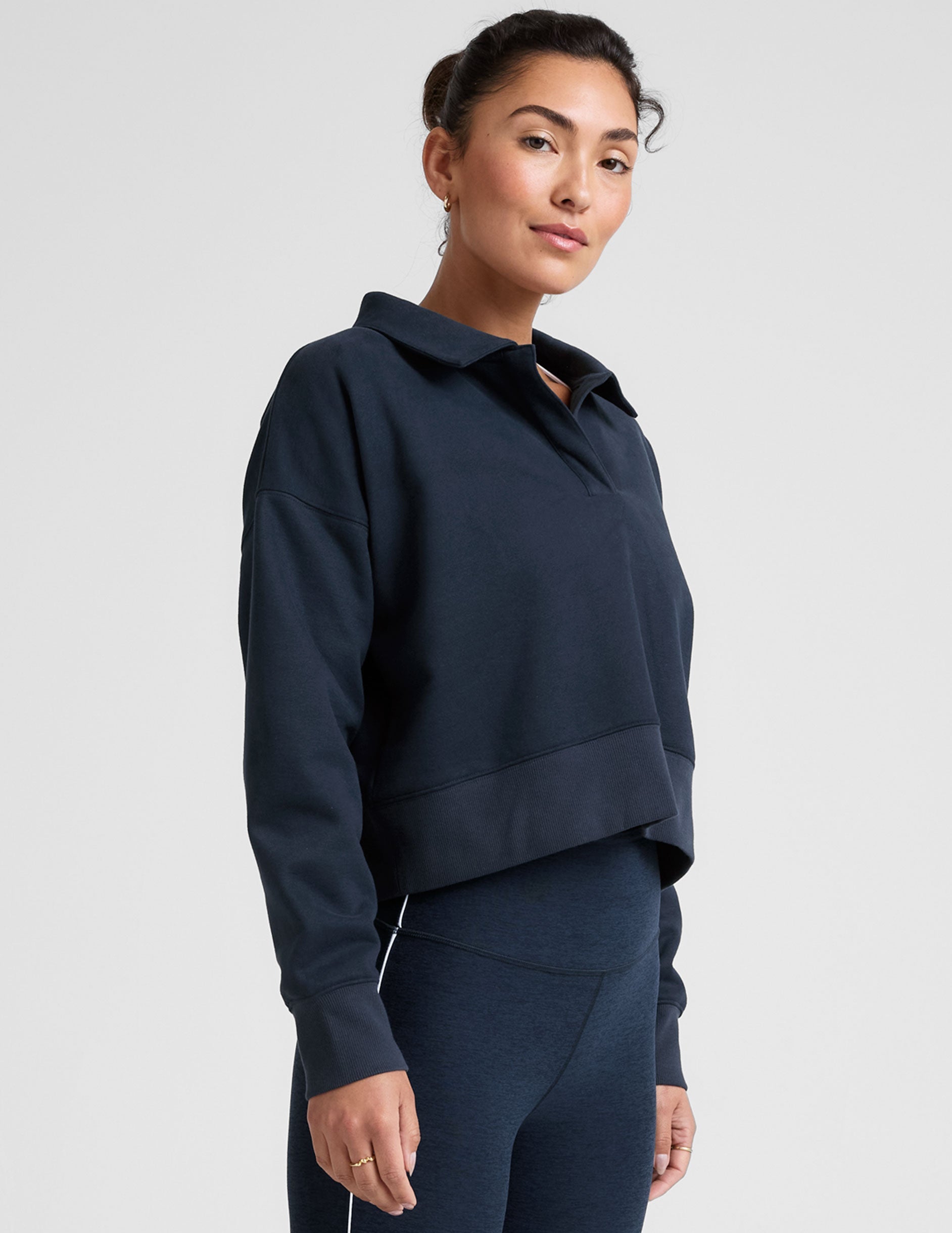 blue cropped long sleeve pullover with a v-neck collared neckline.