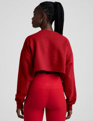 red cropped crew neck loose fitting sweatshirt.