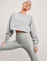 gray cropped crew neck loose fitting sweatshirt.