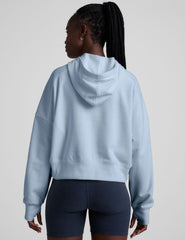 blue cropped pullover with a hood with drawcord and a kangaroo pocket.