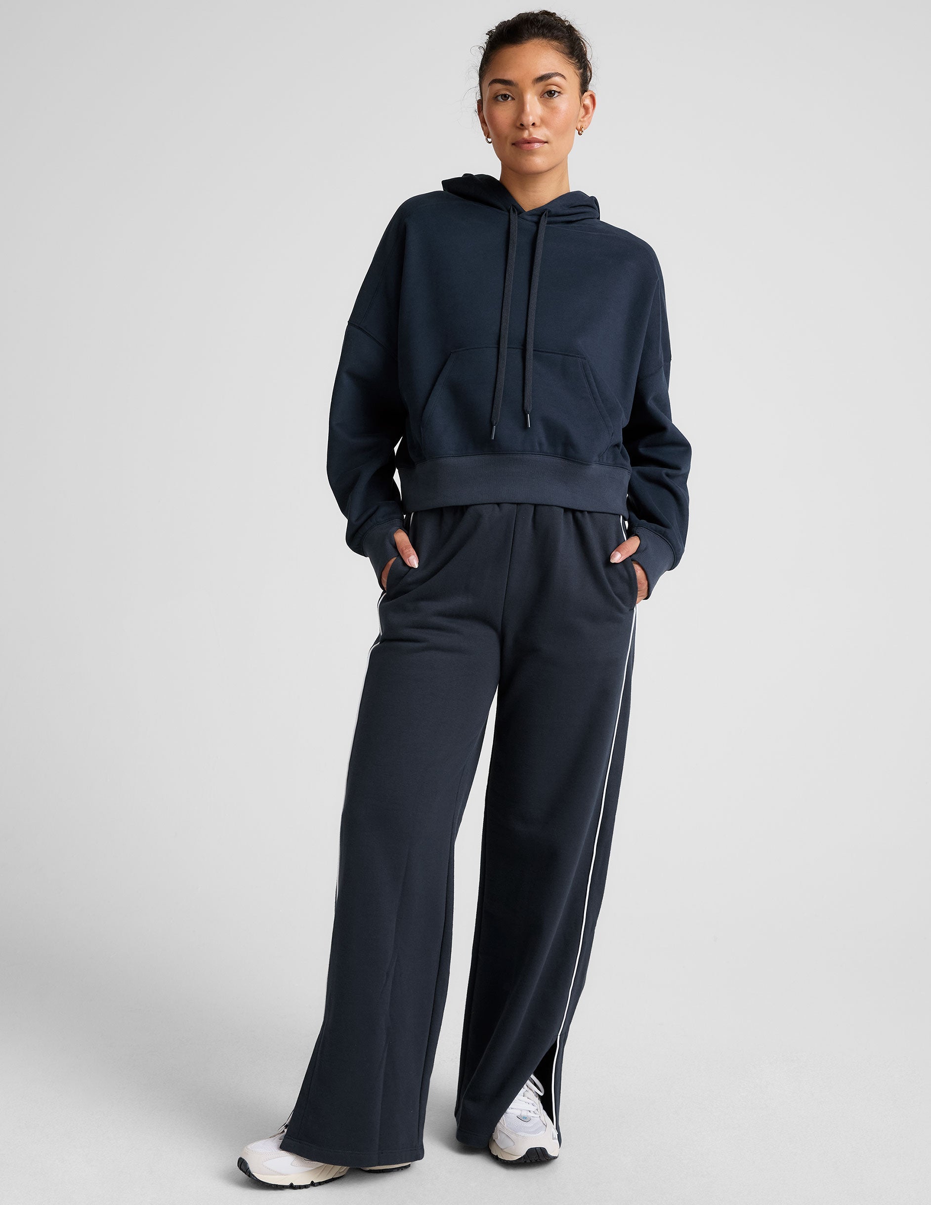 blue cropped pullover with a hood with drawcord and a kangaroo pocket.