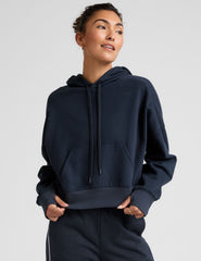 blue cropped pullover with a hood with drawcord and a kangaroo pocket.