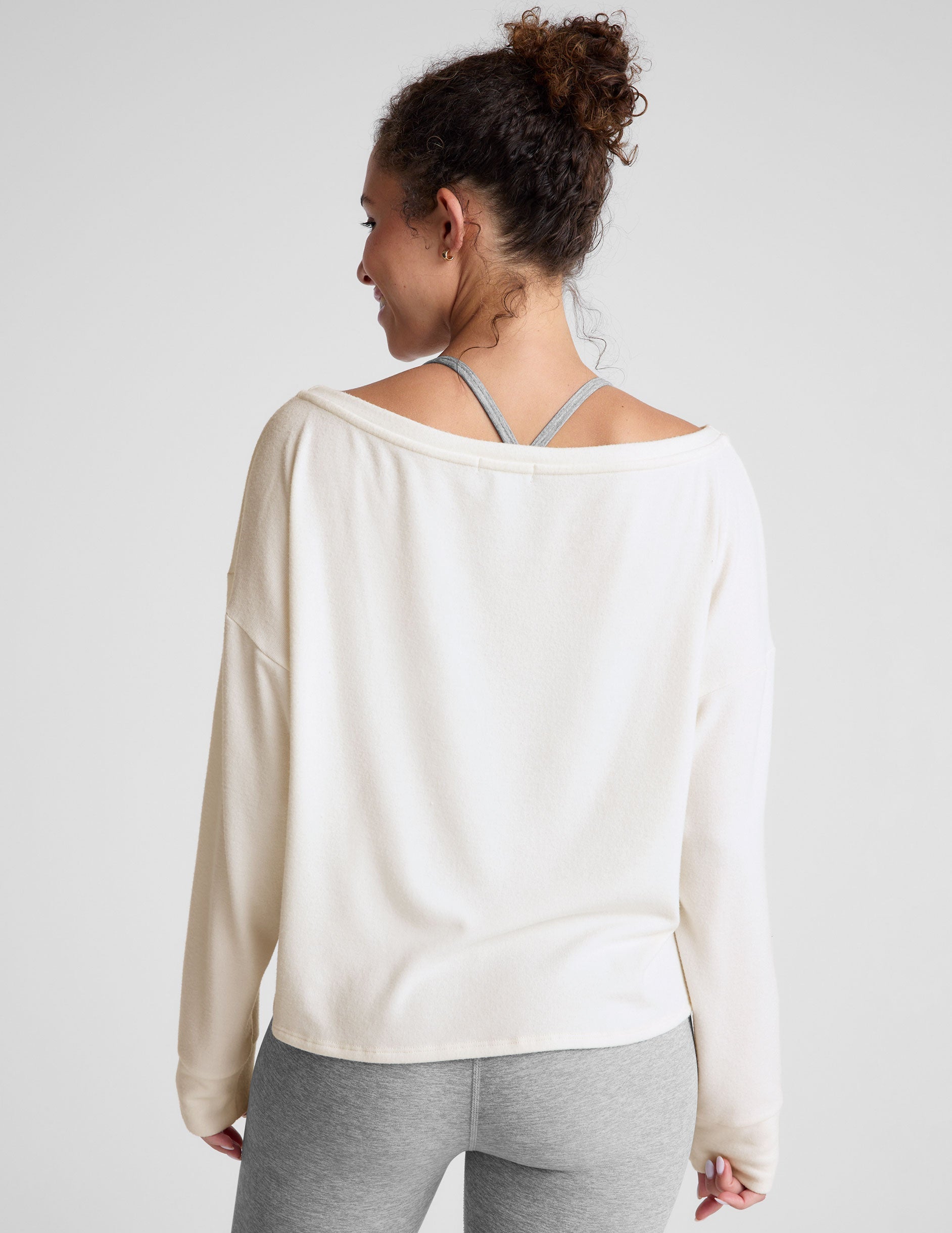 white boatneck long sleeve pullover.