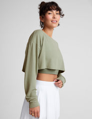 green 2-way long sleeve cropped shrug.