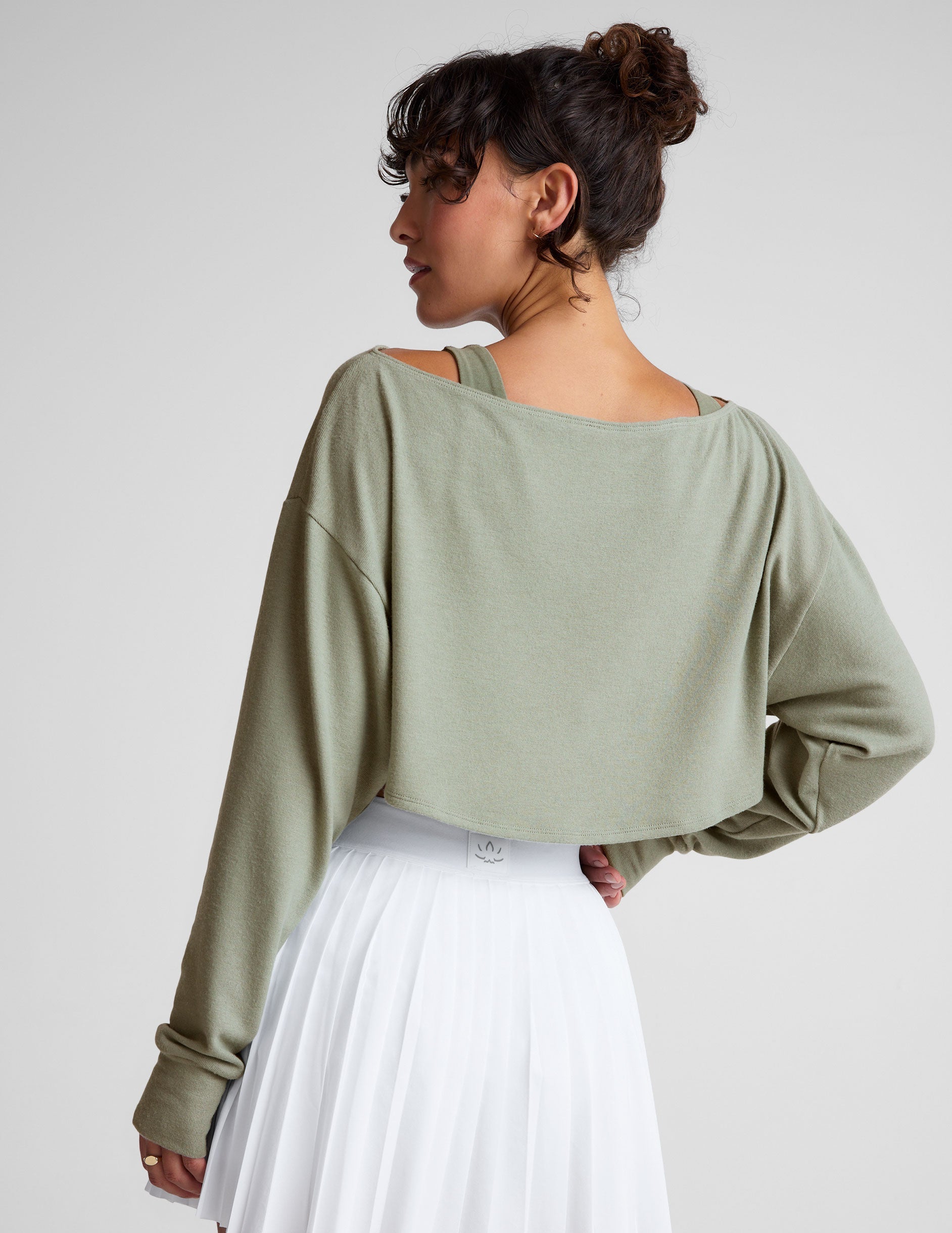 green 2-way long sleeve cropped shrug.