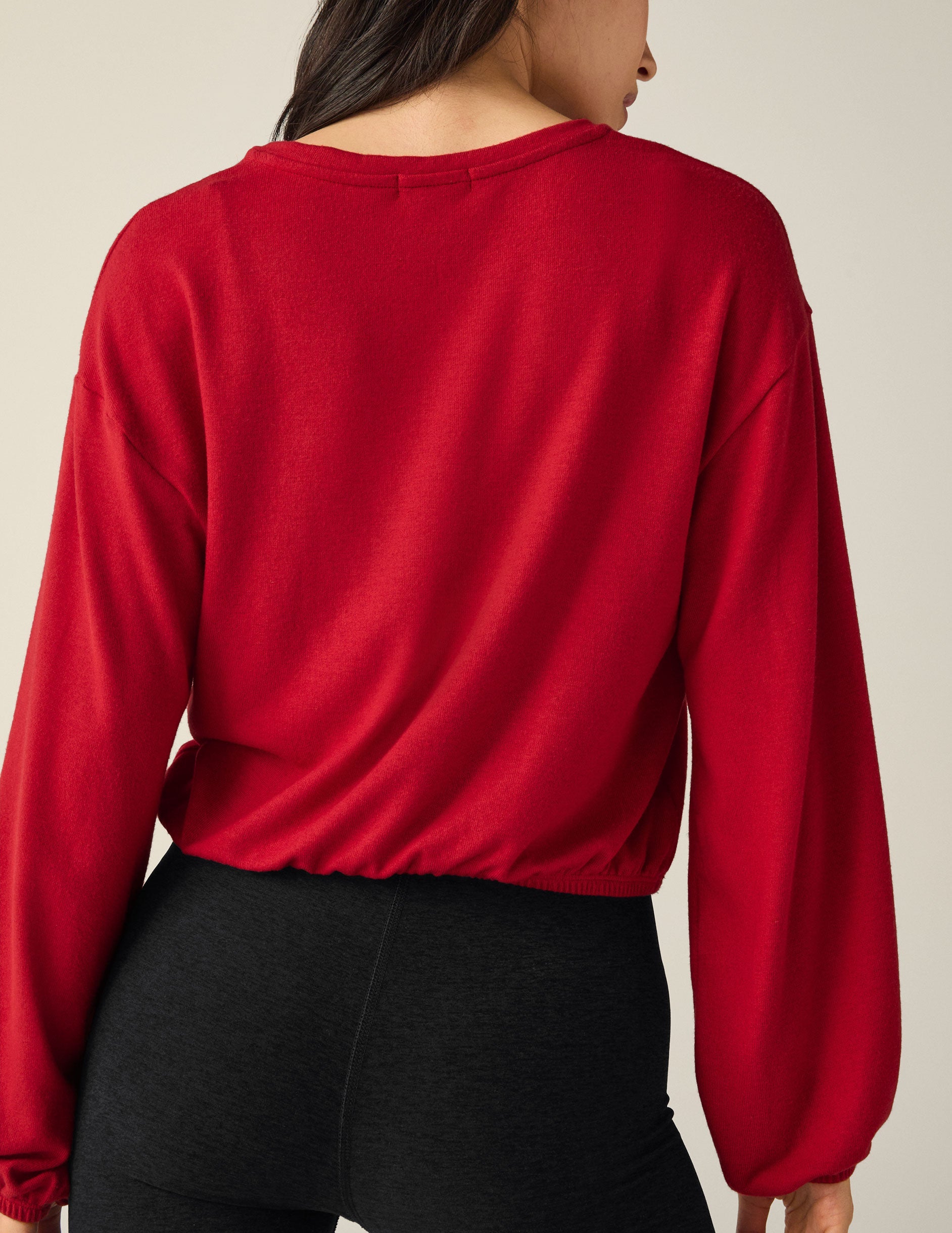 red v-neck cropped sweater.