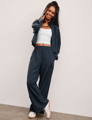 blue mid-rise wide leg pant with pockets.