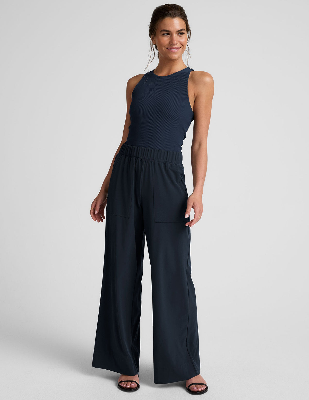blue mid-rise wide leg pant with pockets.