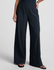 blue mid-rise wide leg pant with pockets.