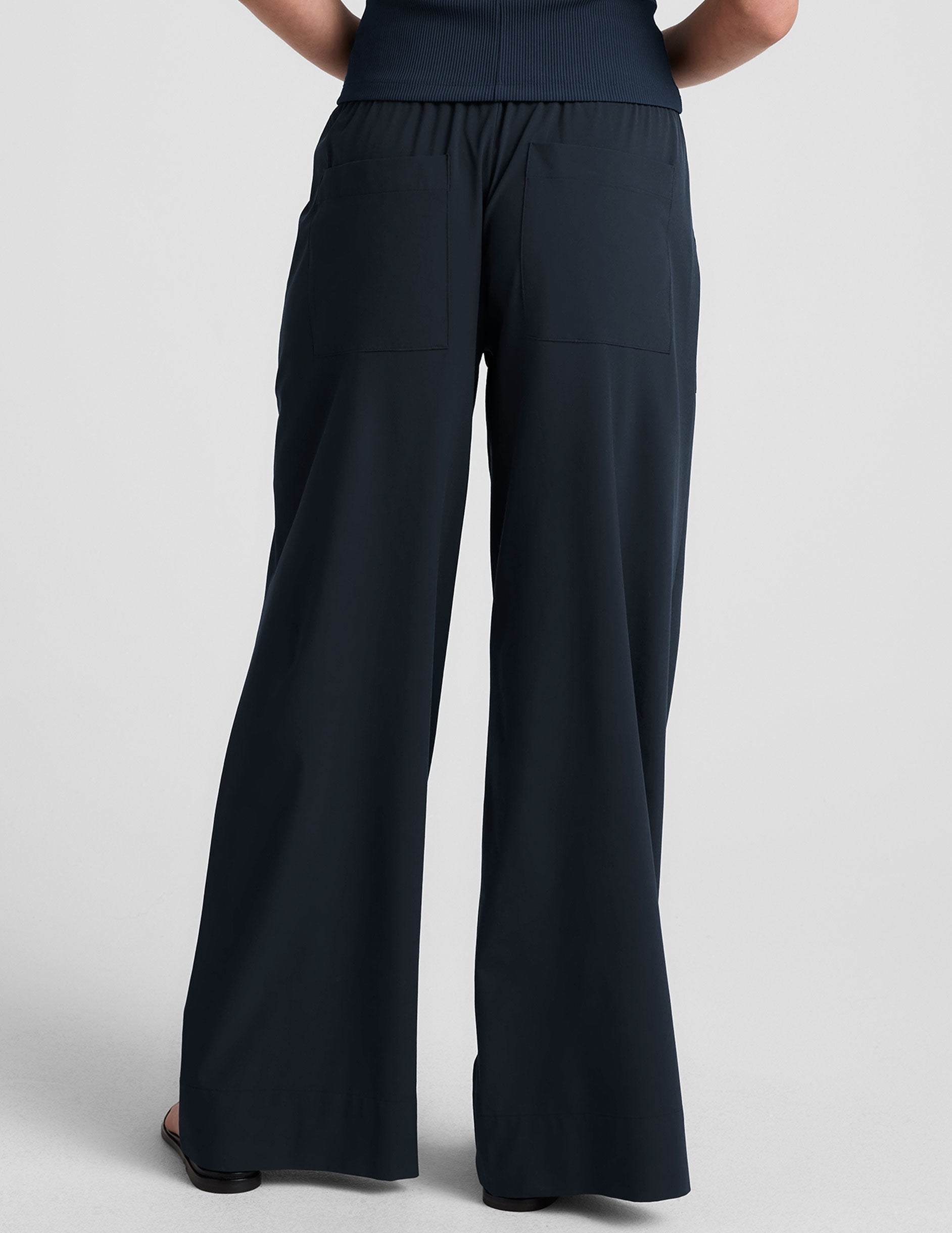 blue mid-rise wide leg pant with pockets.