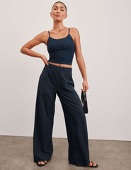 blue mid-rise wide leg pant with pockets.