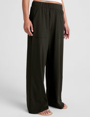 green mid rise pants with front and side pockets.