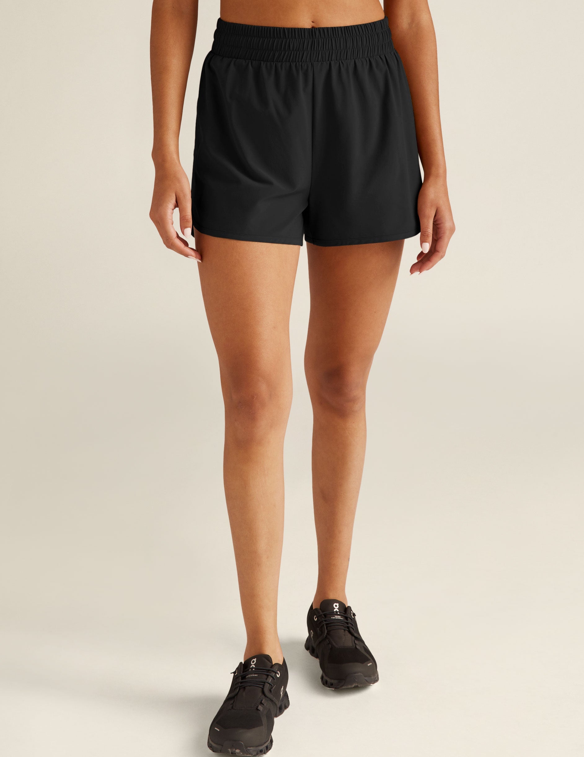 black athletic shorts with built-in shorts underneath.
