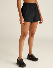 black athletic shorts with built-in shorts underneath.