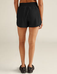 black athletic shorts with built-in shorts underneath.