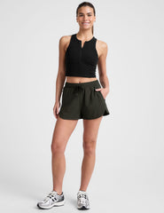 green 2.5" inseam shorts with side pockets and a drawstring at waistband. 