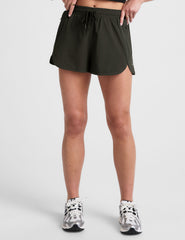 green 2.5" inseam shorts with side pockets and a drawstring at waistband. 