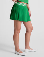green pleated mini skirt with an exposed stripped elastic waistband​ and internal performance shorts with pockets​.