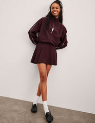 red mini skirt with built-in shorts with pockets.