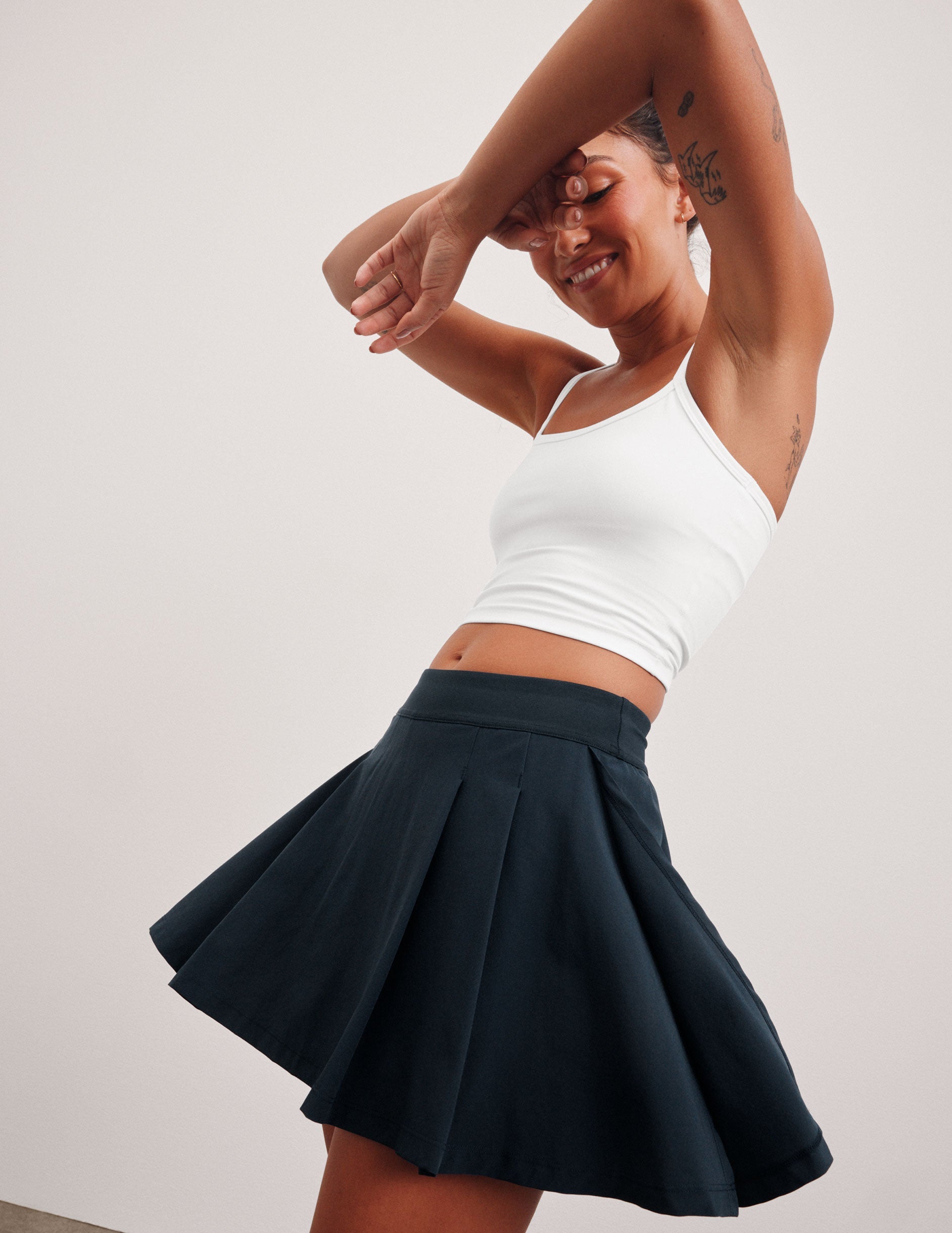blue mini pleated skirt with interior shorts with pockets.