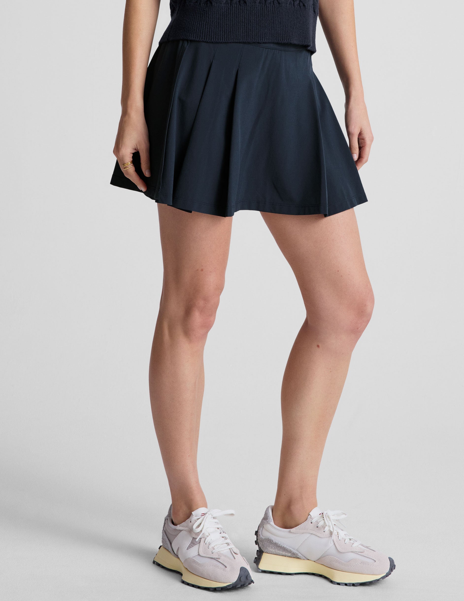 blue mini pleated skirt with interior shorts with pockets.