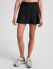 black mini pleated skirt with interior shorts with pockets.