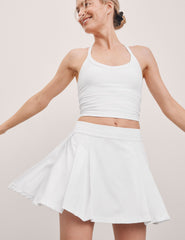 white mini pleated skirt with interior shorts with pockets.