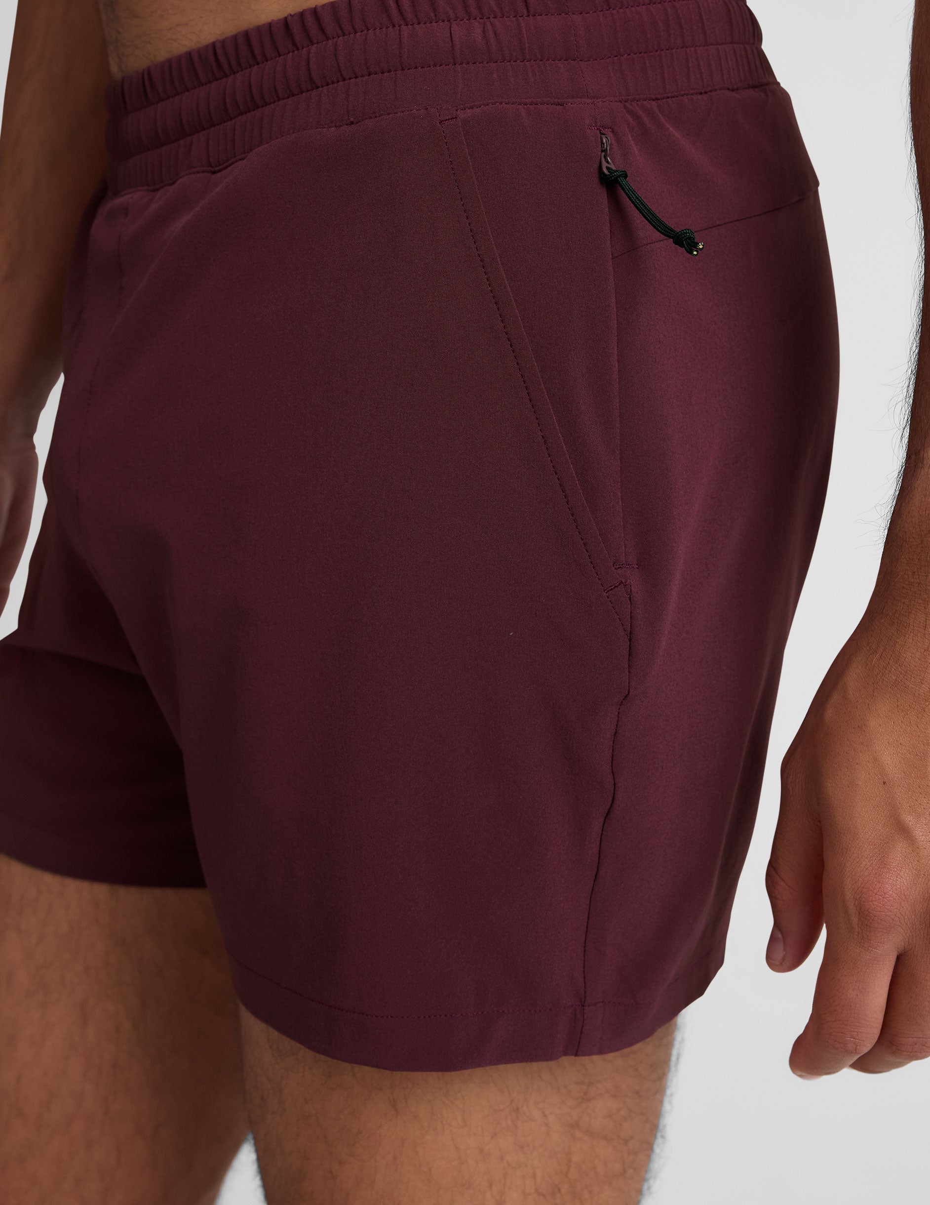 maroon men's 5" shorts on a plain background. 