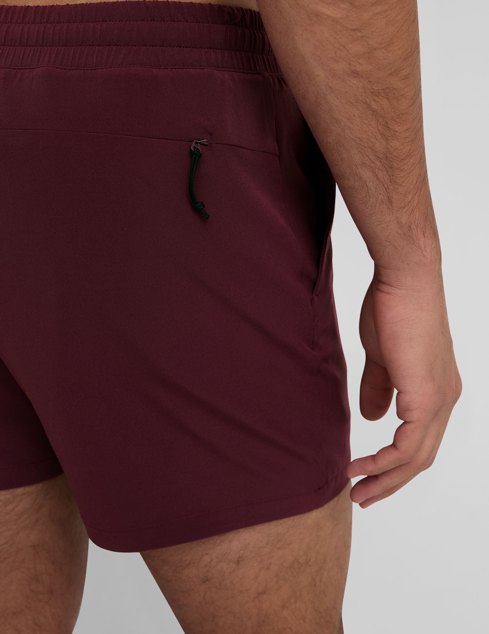 maroon men's 5" shorts on a plain background. 