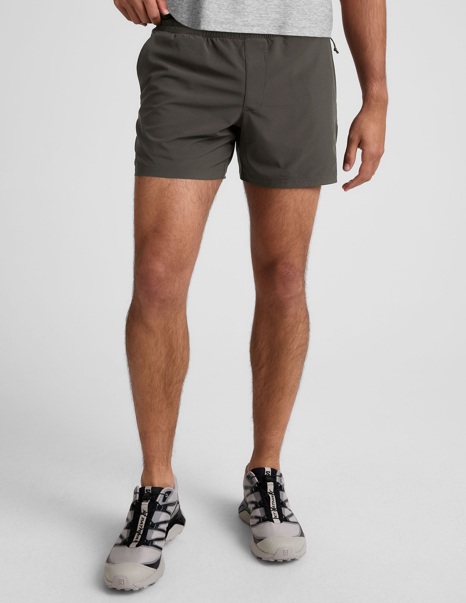 grey men's 5" shorts on a plain background. 