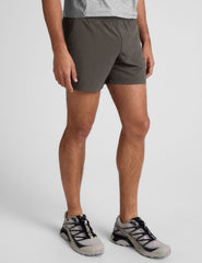 grey men's 5" shorts on a plain background. 