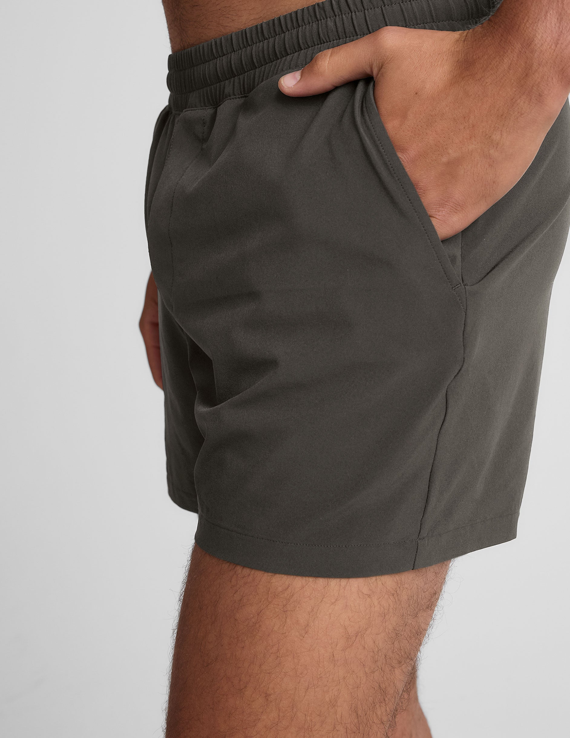 grey men's 5" shorts on a plain background. 