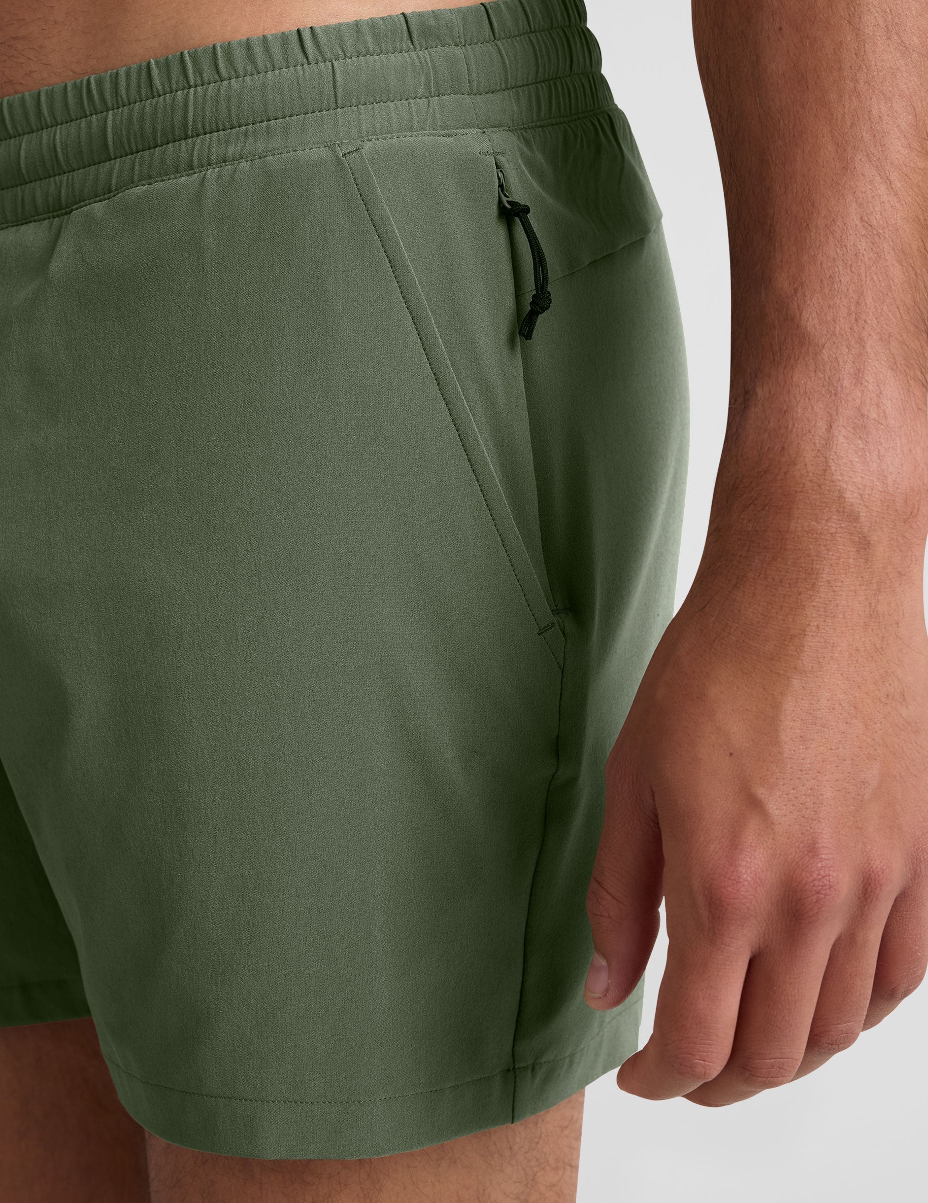 green men's 5" shorts on a plain background. 