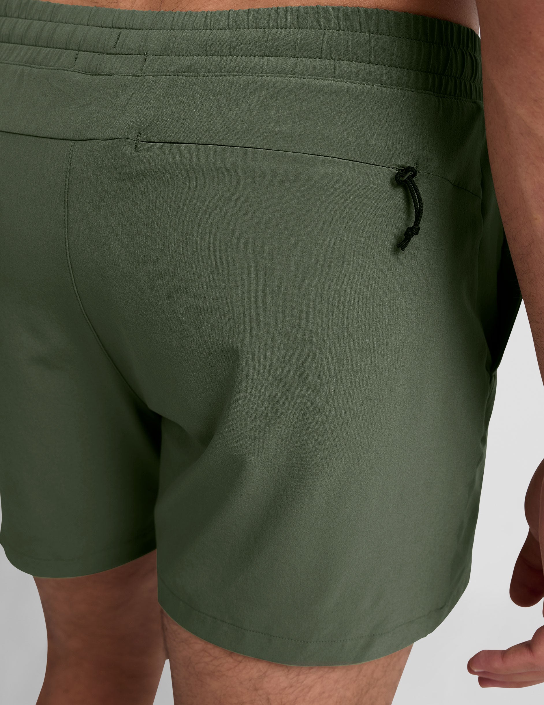 green men's 5" shorts on a plain background. 