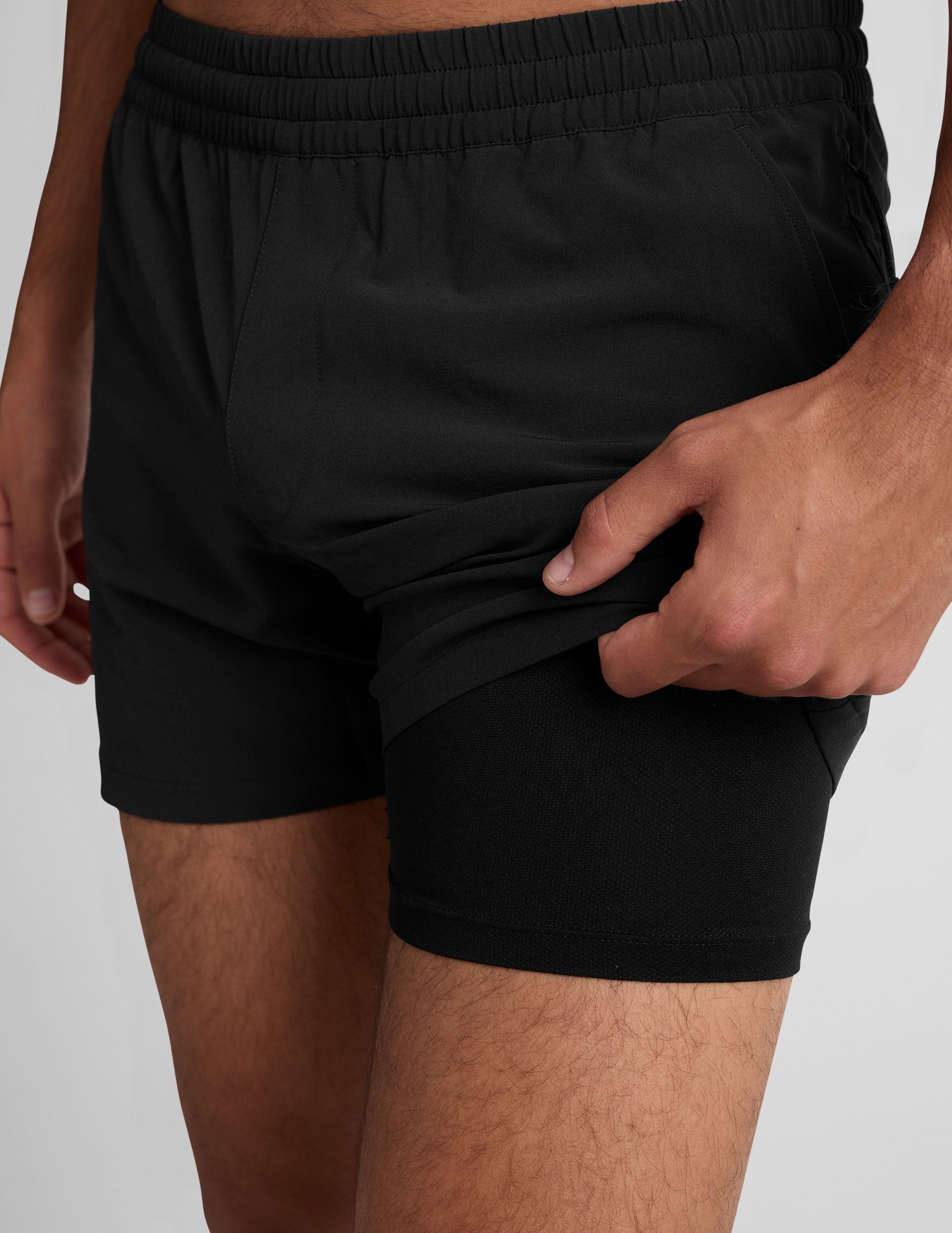 black 5" men's shorts on a plain background. 