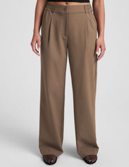 brown mid-rise trousers with pockets.