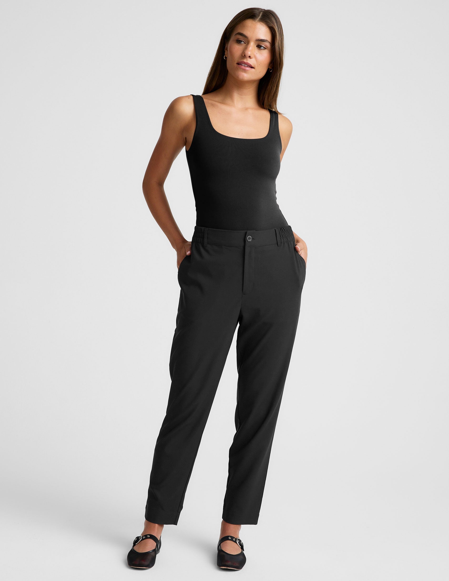 black trouser style pant with a tapered ankle and pockets.