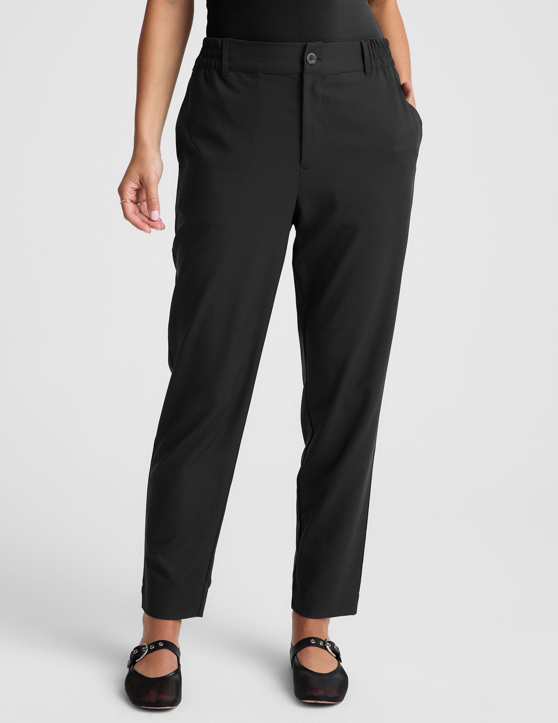 black trouser style pant with a tapered ankle and pockets.
