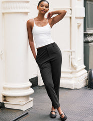 black trouser style pant with a tapered ankle and pockets.