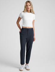 blue trouser style pant with a tapered ankle and pockets.