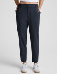 blue trouser style pant with a tapered ankle and pockets.