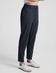 blue trouser style pant with a tapered ankle and pockets.