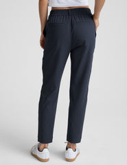 blue trouser style pant with a tapered ankle and pockets.