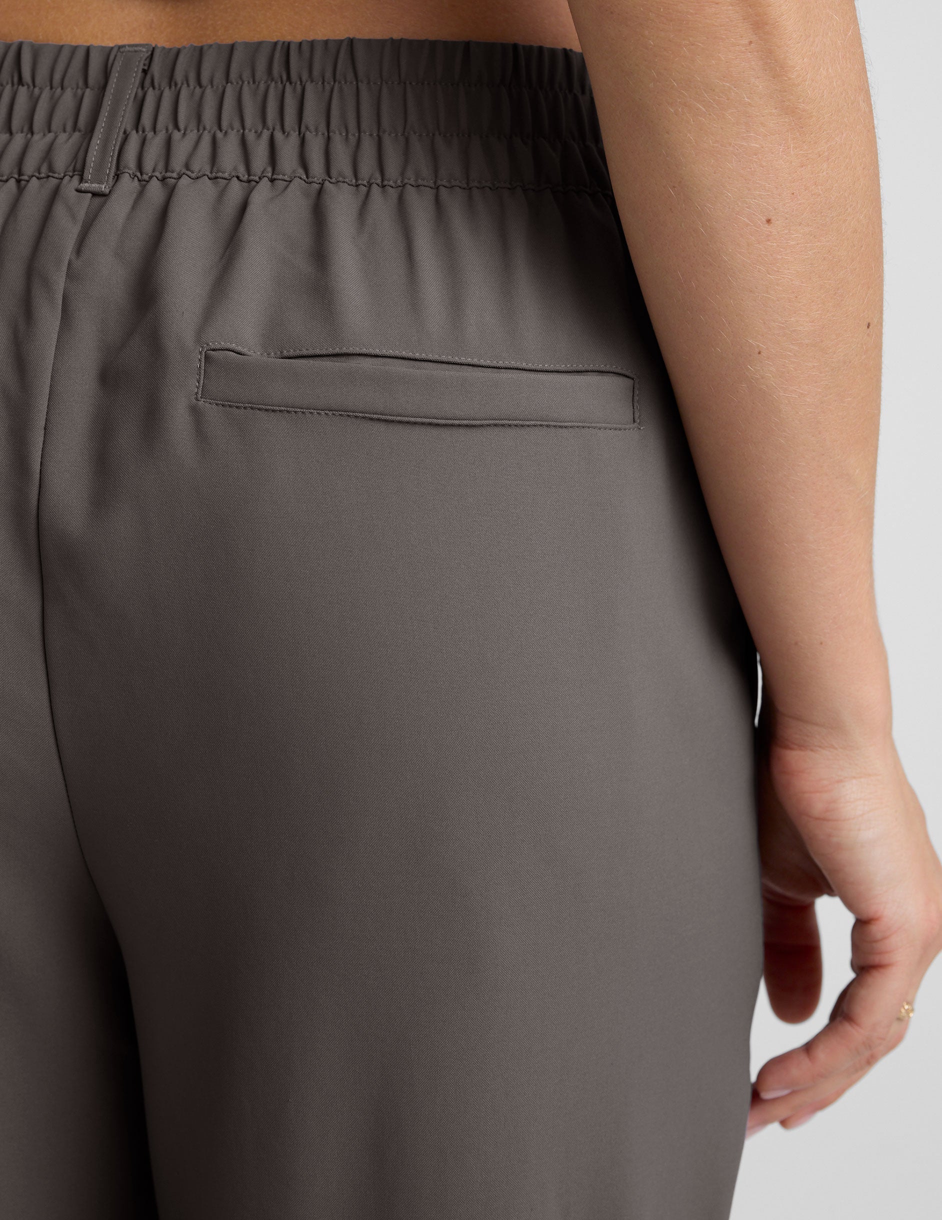 gray trouser style pant with a tapered ankle and pockets.