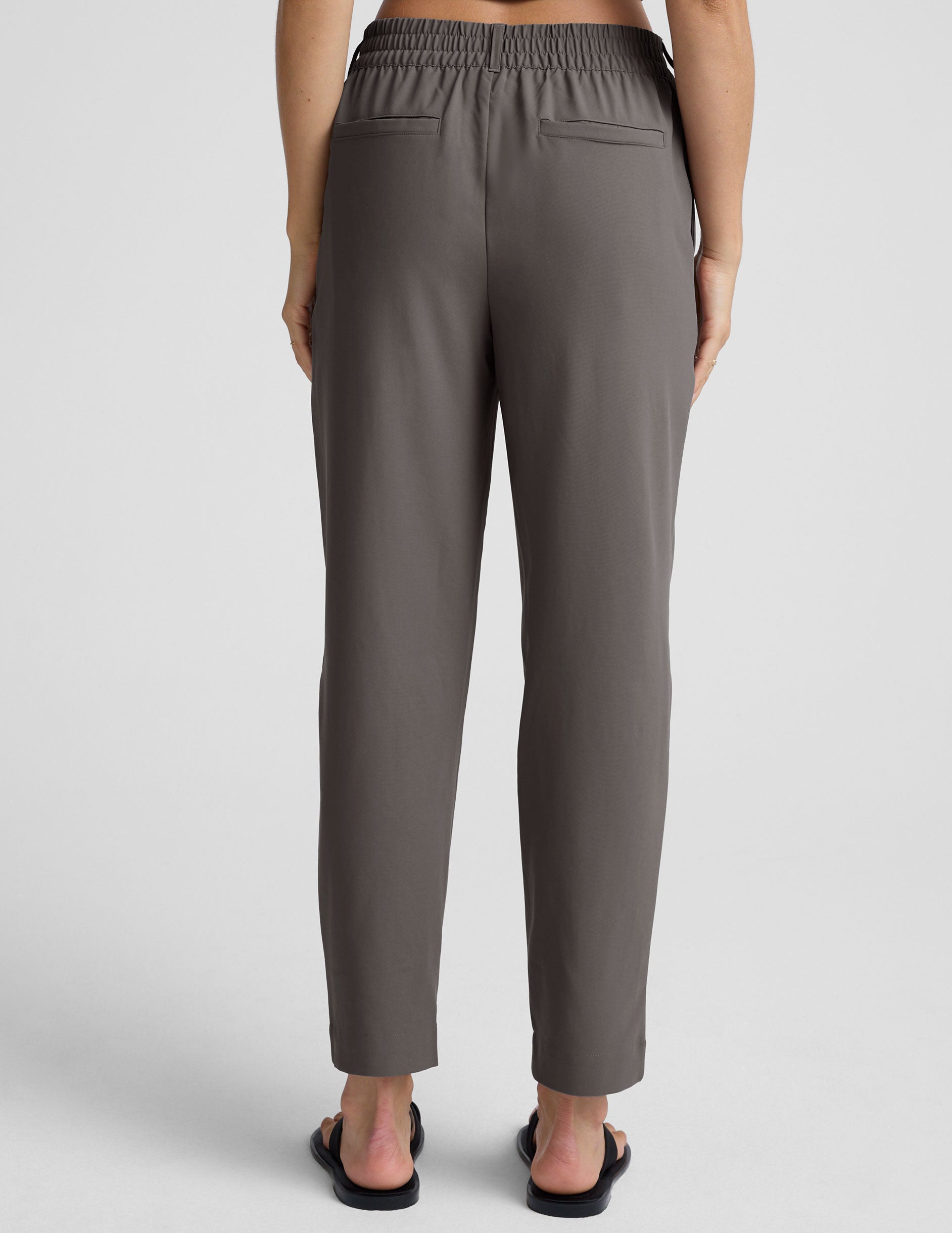 gray trouser style pant with a tapered ankle and pockets.