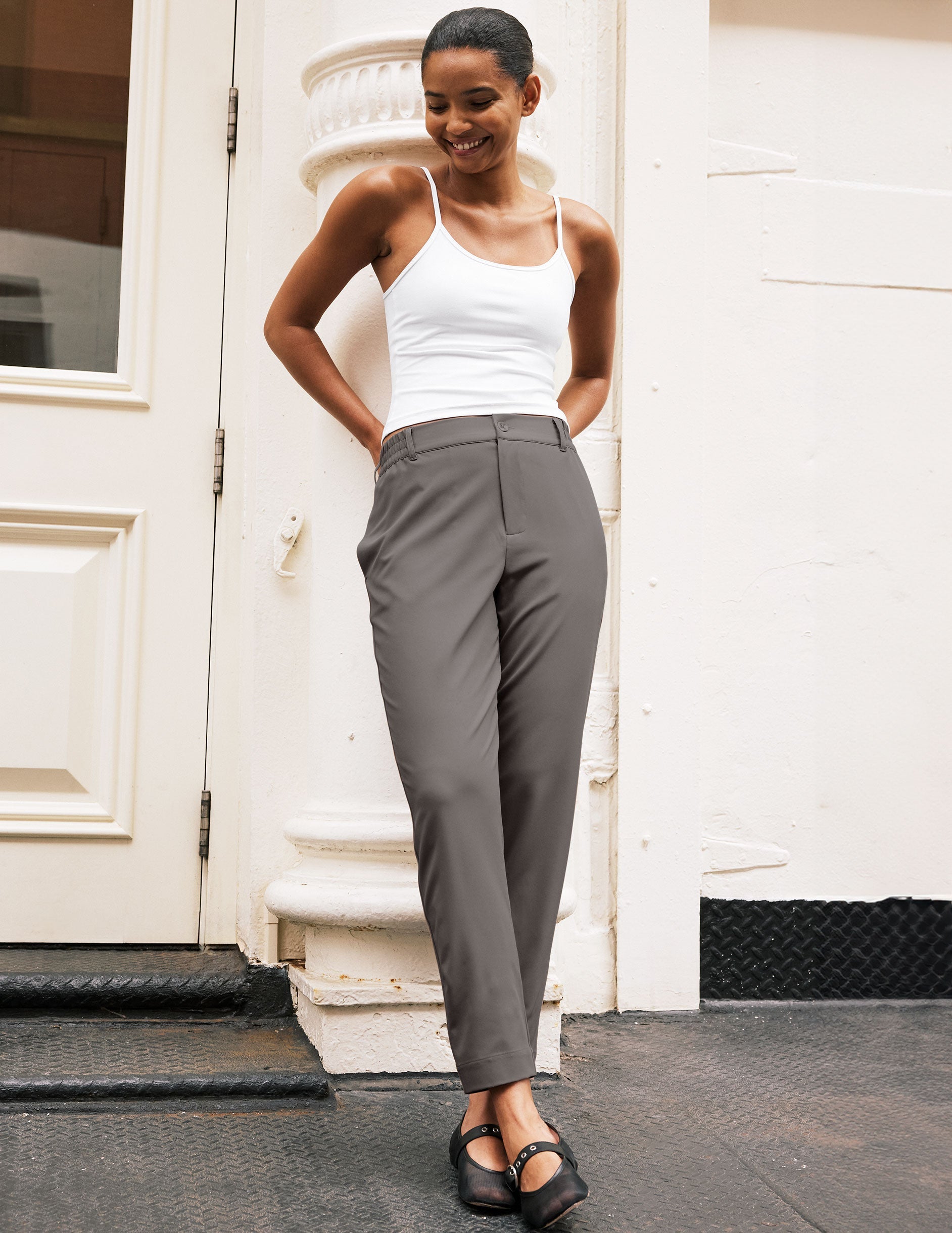 gray trouser style pant with a tapered ankle and pockets.