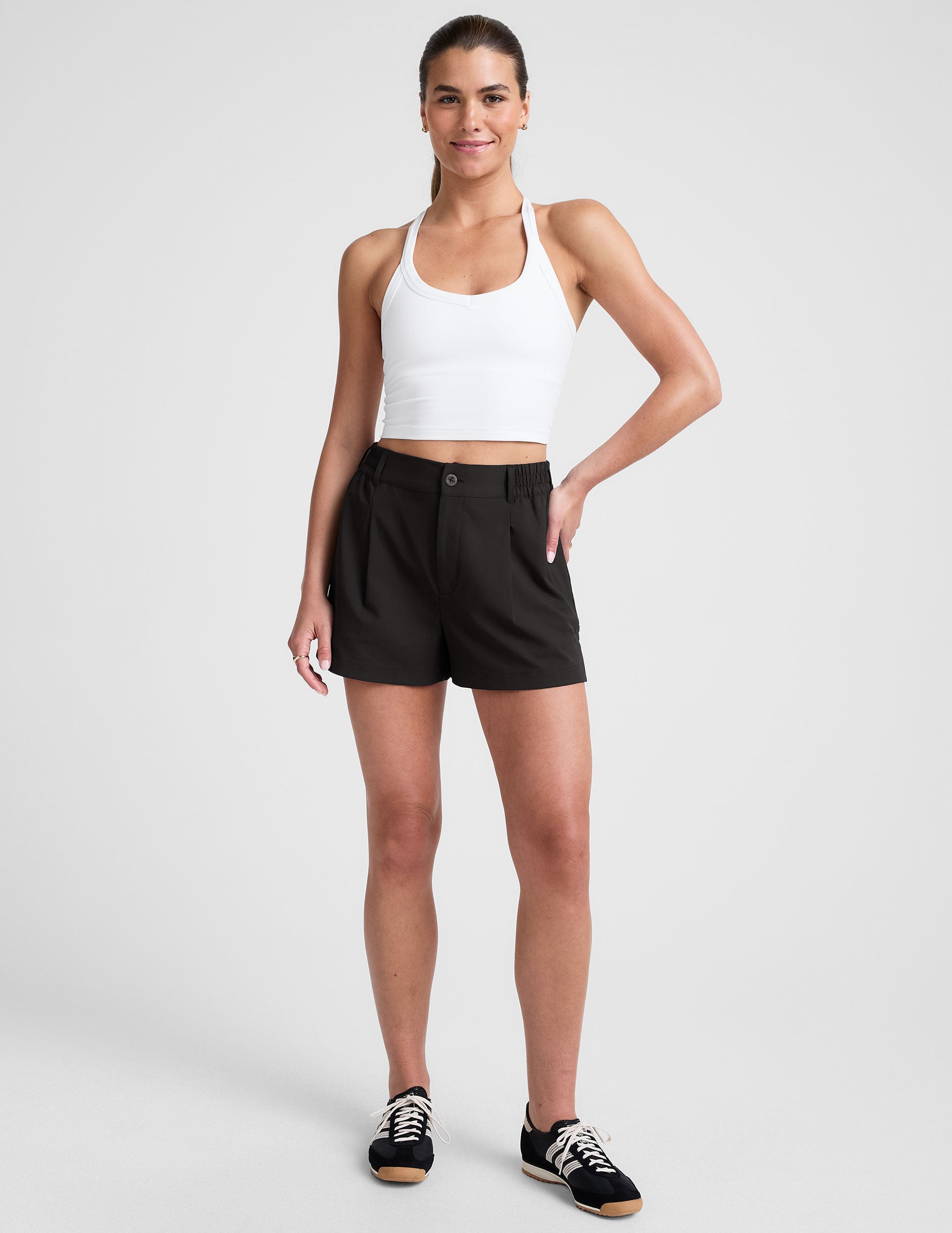 black 4" inseam shorts with an elastic waistband with belt loops​ and side seam pockets. 