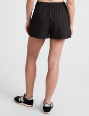 black 4" inseam shorts with an elastic waistband with belt loops​ and side seam pockets. 