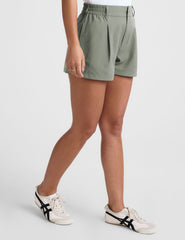 green shorts with an elastic waistband,  front zipper, button, and belt loops. 